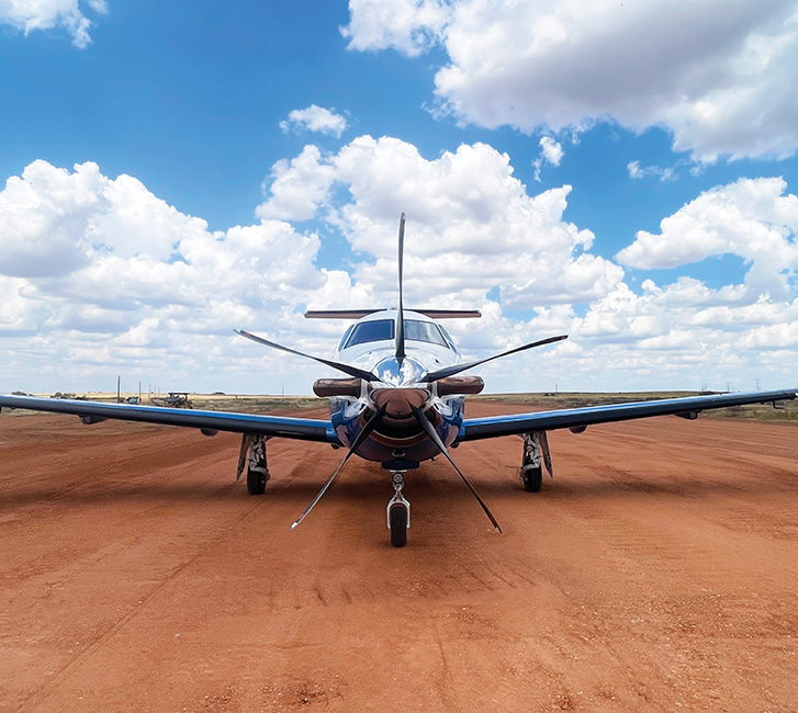 PlaneSense PC-12 on dirt runway at private ranch in Texas